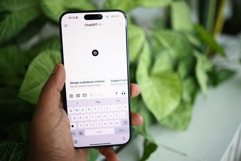 Close up of a smartphone screen showing the ChatGPT interface. A good SEO expert should also consider AI search in the daily work.