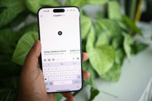 Close up of a smartphone screen showing the ChatGPT interface. A good SEO expert should also consider AI search in the daily work.